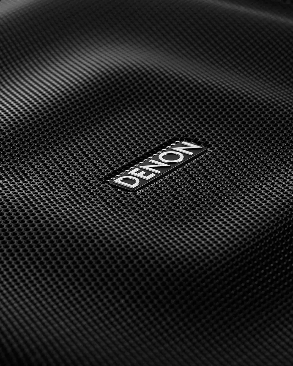 Macro of the Denon badge on the Home Amp’s fabric top